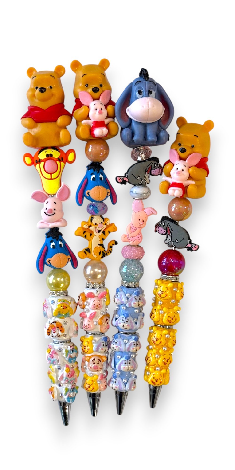Four Winnie the Pooh Wands lined up together